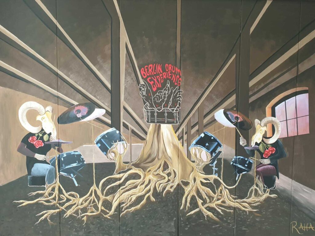 The original BDE mural with drumming characters and the Berlin Drum Experience logo