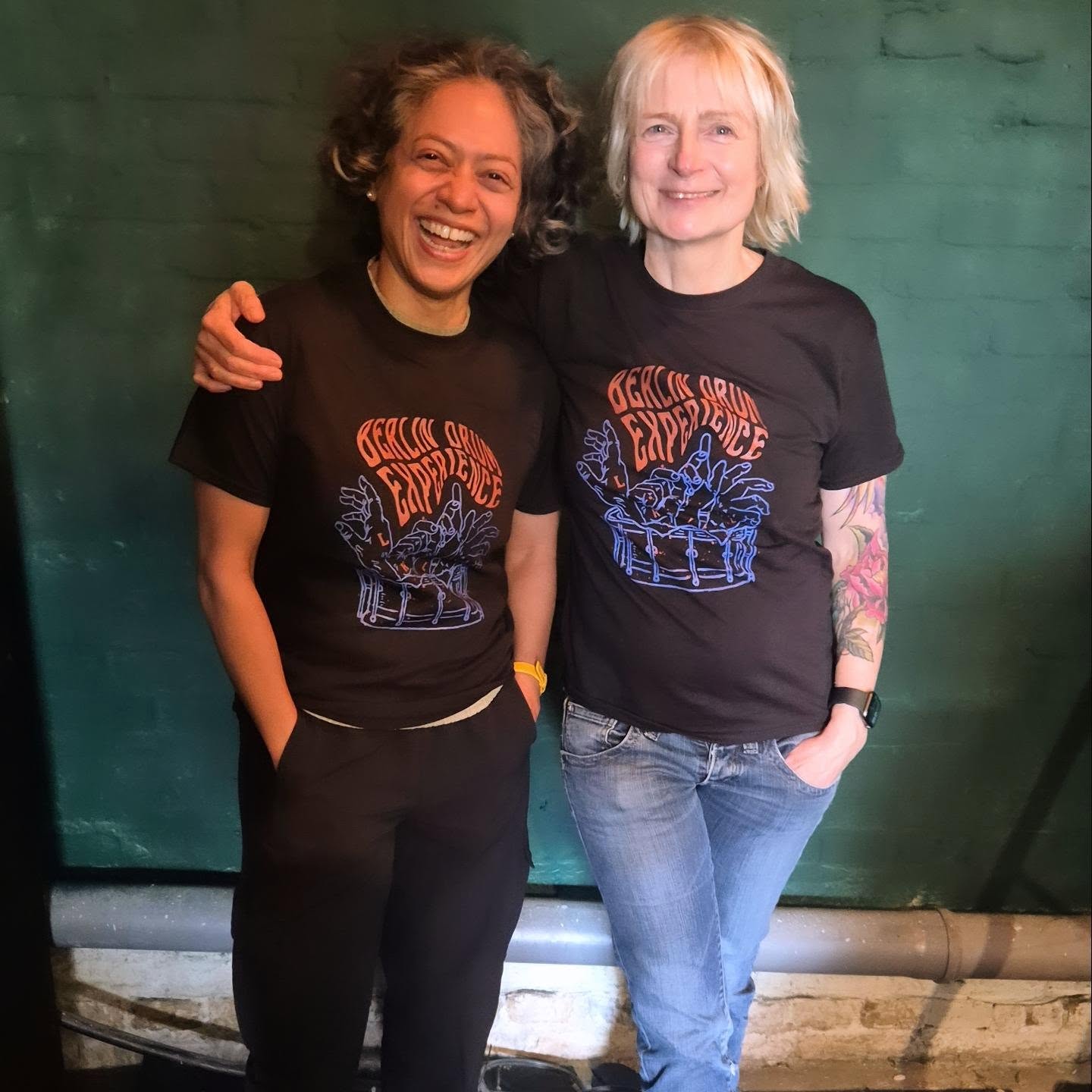 Two smiling BDE drummers proudly wearing their drumgang T-shirts